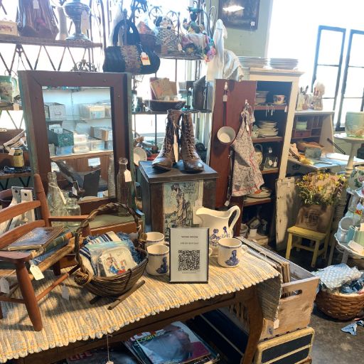Antique booth with Chataboom QR code displayed on the table