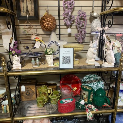 Antique dealer booth with prominently displayed Chataboom QR code